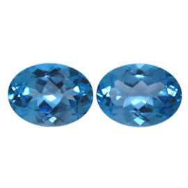 30.90 cttw Intense Blue Pair of Oval Natural Topazs